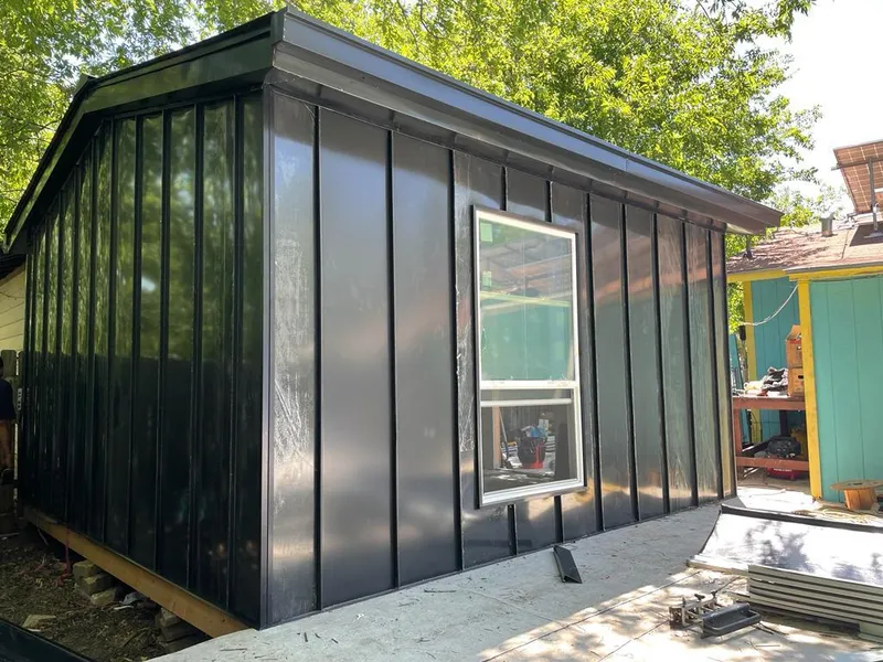 Black standing seam metal wall panels for Roof Inspection in Atascocita