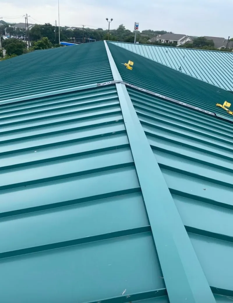 Green commercial metal roof ridge and valley for Metal Roof Repair in Atascocita